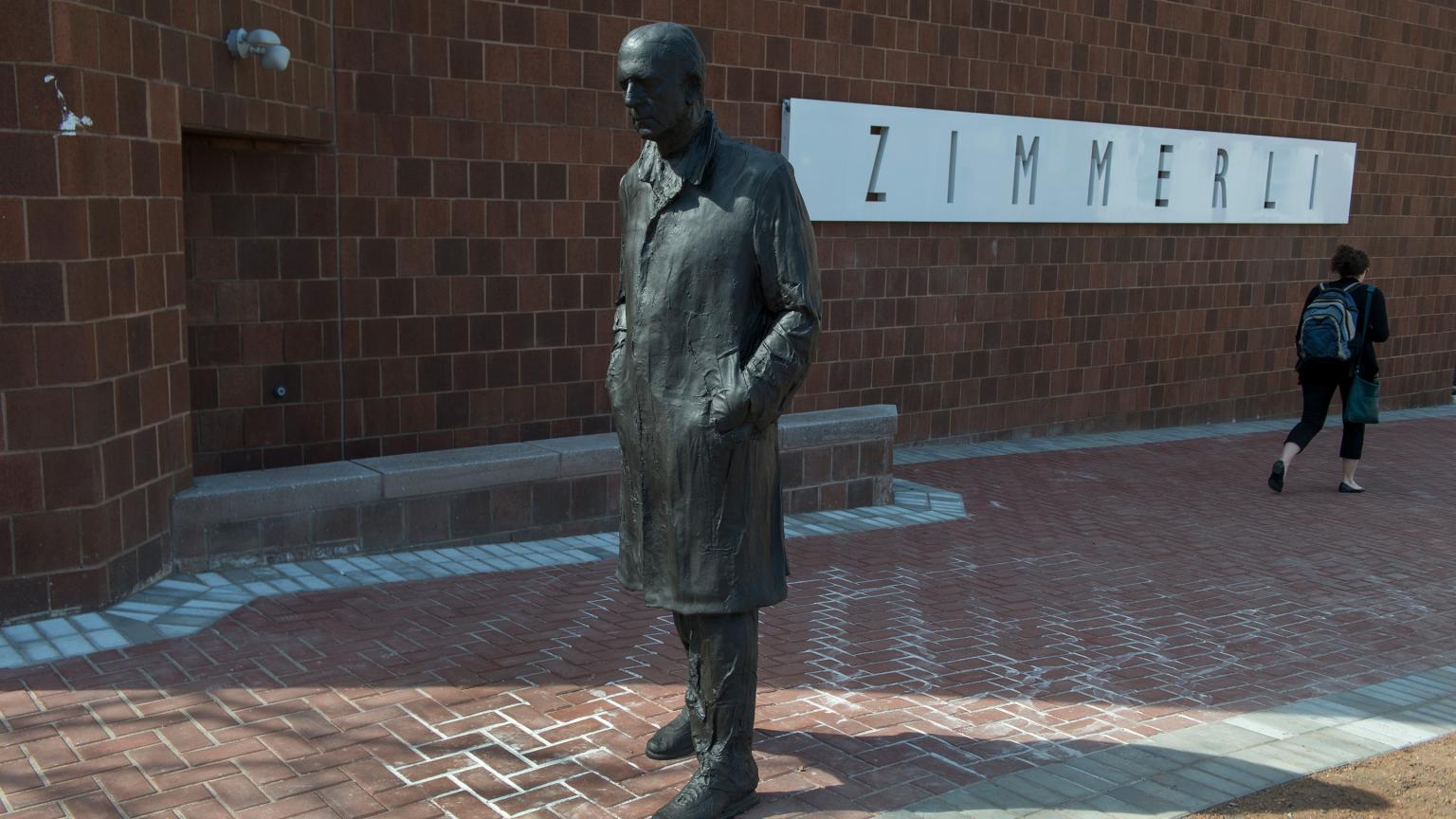 Walking Man (1988) sculpture by George Segal installed outside the Zimmerli Art Museum
