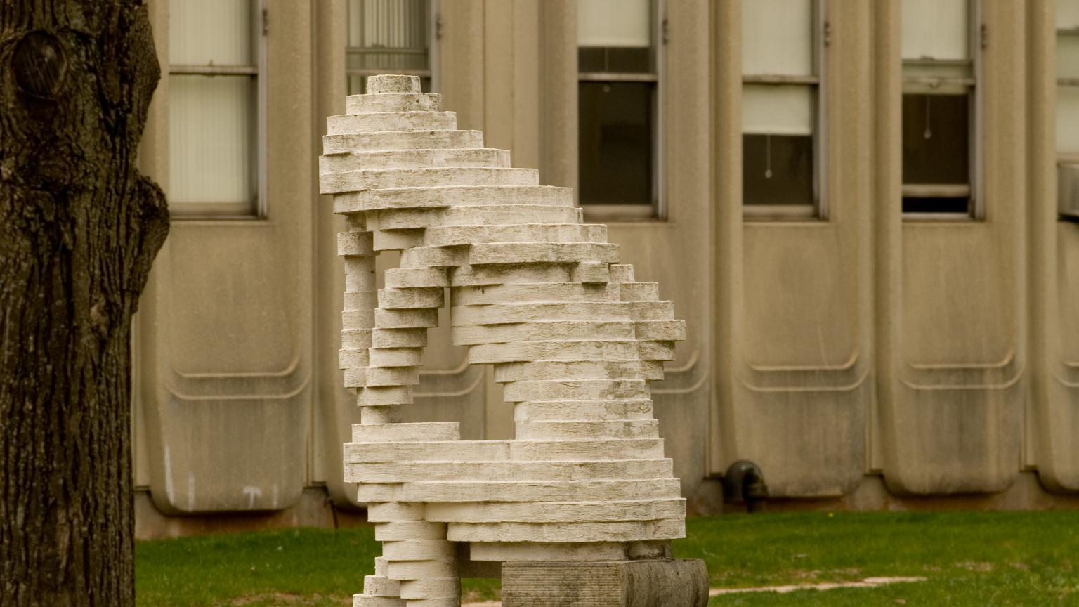 Reflections sculpture by Reuben Karol outside an engineering building on Busch campus