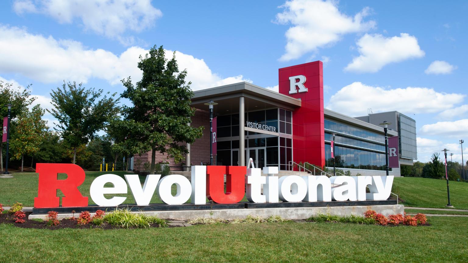 Revolutionary monument sits in front of the Visitor Center under a blue sky