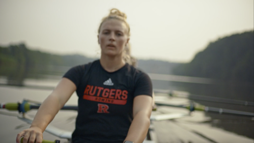 Rutgers student rowing in Raritan River