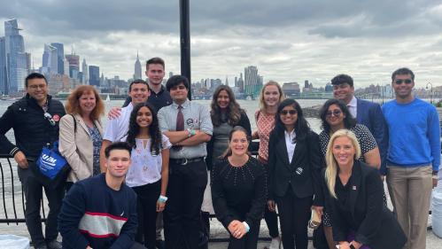 Students, faculty, and staff from the Innovation, Design, and Entrepreneurship Academy at a pitch competition.