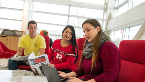 Students studying together in a brightly-lit lounge