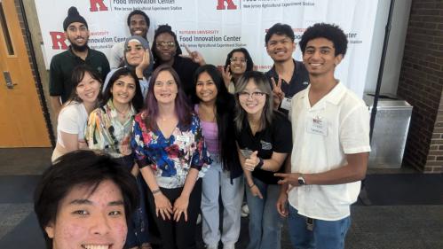 IDEA Interns in front of Rutgers banner at NJ FoodTech 2024