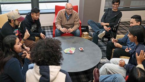 J.D. Bowers (center), dean of the Honors College at Rutgers–New Brunswick, plays Uno with a group of students, including (visible faces from left to right) Samantha Torres, Luis Sanchez-Gonzalez, Alex Liu, Ali Khan, Josh Ding and Ankita Akanksha.