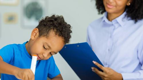 Psychologist with a student at school