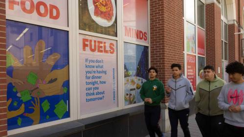 Large decals of art by Hudson County Community College students are displayed on the windows of the college’s library in Jersey City.