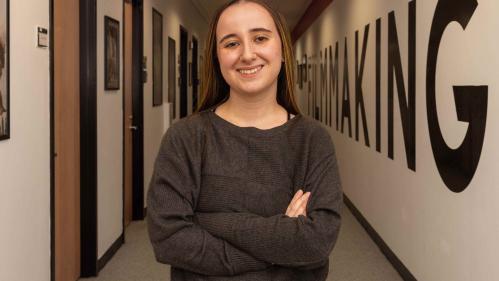 Madeline Hettrick, who wrote and directed the short film “His New Girl,” stands in the hallway outside the Rutgers Filmmaking Center.