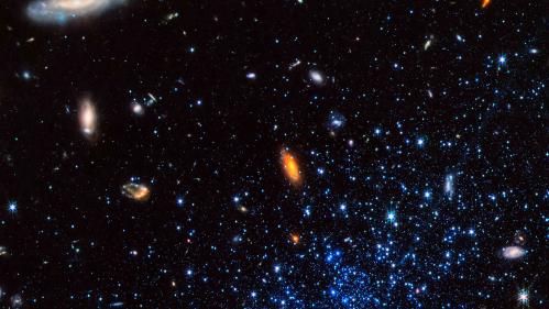 image of outer space with blobs of orange and blue superimposed over a black background