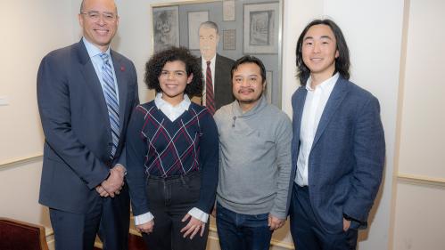 (l. to r.) President Jonathan Holloway with Beatrys Mendez (MGSA ’24), Kabi Raj Lama (MGSA ’24) and Henry Wang (MGSA ’24) at a celebration of the three student artists
