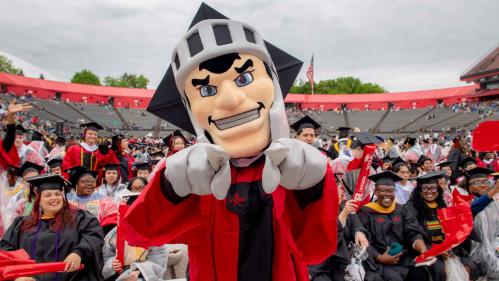 The Scarlet Knight helps graduates celebrate at Rutgers' 258th anniversary commencement on Sunday, May 12.