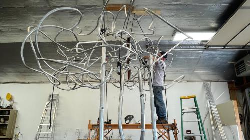 Patrick Strzelec, professor emeritus at the Mason Gross School of the Arts, works on the sculpture "Past is Prologue" in his Carversville, Pa., studio.