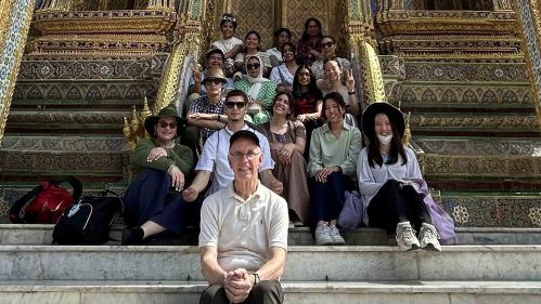 Rutgers professor Mark Robson (front) and his students pose for a group shot at the Grand Place in Bangkok.