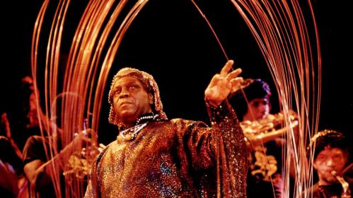 Jazz musician Sun Ra performs on stage with his band Arkestra.