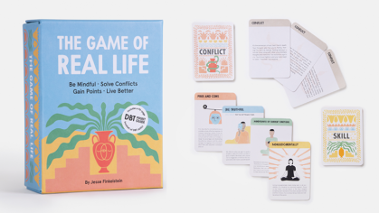 The colorful container and sample cards from The Game of Life