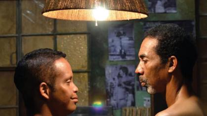 Two people look at each other in a still from the film, El Especial (Special)