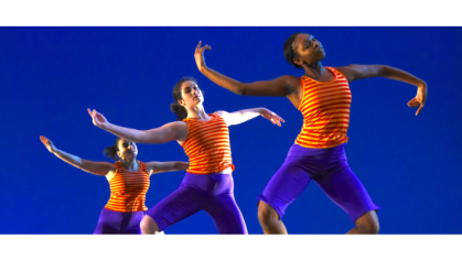 Mason Gross female dancers in orange tops and blue shorts