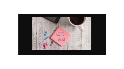 Coffee mug on table with sticky note and paperclips