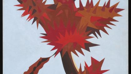A red cactus or plant rises above a gray background.