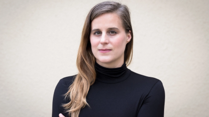 Headshot of Lauren Groff in front of a wall