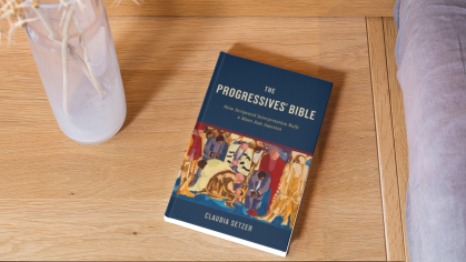 An AI-generated image of the book cover for The Progressives' Bible on the floor.