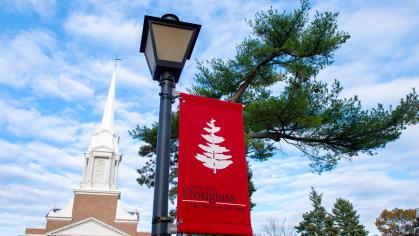Douglass campus banner outside of the Voorhees Chapel