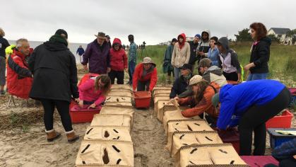 People create sand barriers on a beach in New Jersey