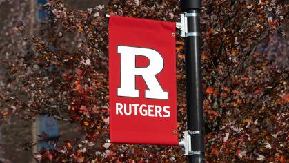 A red banner bearing Rutgers University's block R logo 