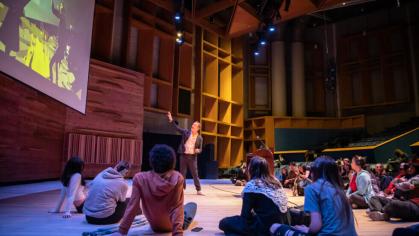 Students listening to an instructor during an Interplay class