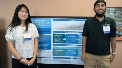 A photo of 2 students presenting their medical research