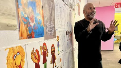 Chief muppet designer speaking with Rutgers students as part of a classroom enrichment activity for a Children in Media course