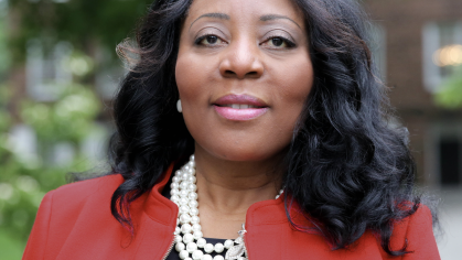 Dr. Francine Conway headshot in red blazer and white shirt