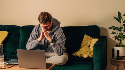 Man depressed on the computer