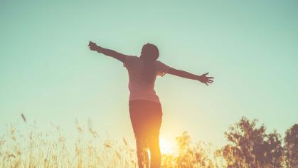 a happy woman enjoying fresh air