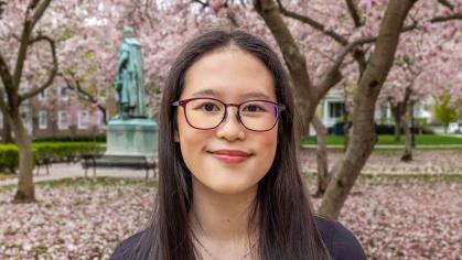 Rutgers-New Brunswick senior Amelia Khoo smiles for the camera at Voorhees Mall on the College Avenue campus.