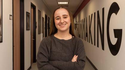 Madeline Hettrick, who wrote and directed the short film “His New Girl,” stands in the hallway outside the Rutgers Filmmaking Center.
