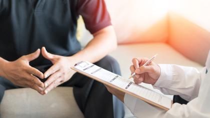 Man talking to his doctor