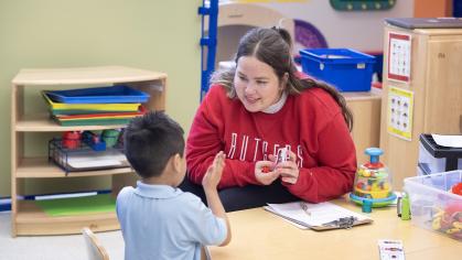 Rutgers junior Ara Spielman works with a preschooler at Paul Robeson Community School for the Arts.