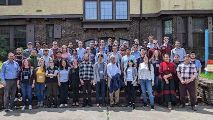 A group of men and women assembled in front of the Rutgers Inn