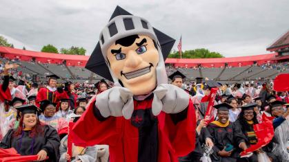 The Scarlet Knight helps graduates celebrate at Rutgers' 258th anniversary commencement on Sunday, May 12.