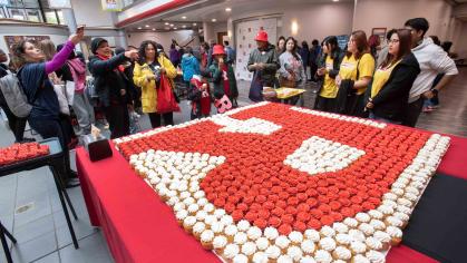 Visitors gather around a cupcake display inside the College Avenue Student Center during Rutgers Day 2023.