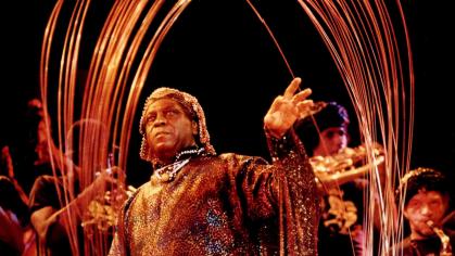 Jazz musician Sun Ra performs on stage with his band Arkestra.