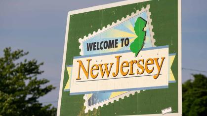 A highway sign reads, "Welcome to New Jersey."