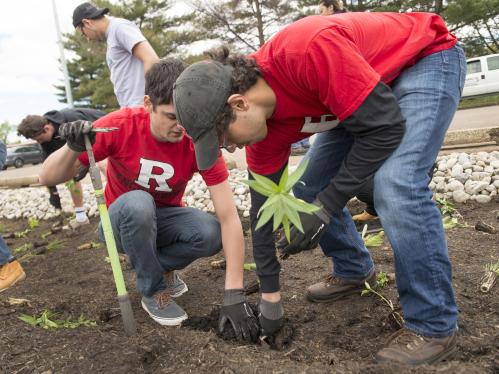 students planting a garden