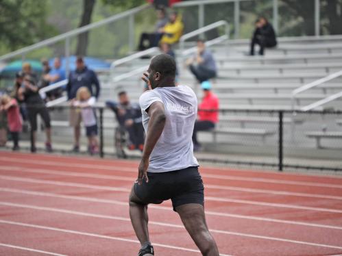 A blind student athlete runs on a track