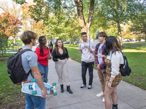 students talk outside on Voorhees Mall on College Avenue Campus