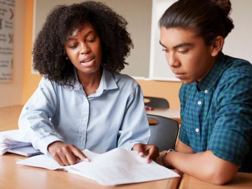 An instructor working one on one with a student