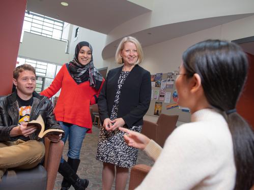 SMLR students and faculty talk in the school