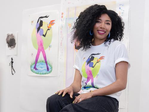 Grace Lynne Haynes wearing the t-shirt she designed for Old Navy for Black History Month