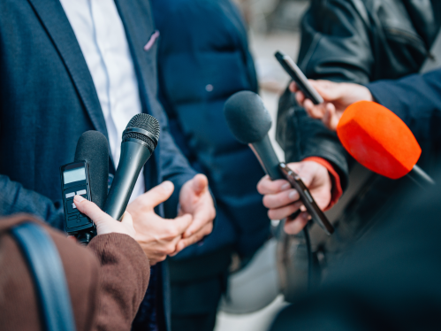 Interviewing a businessman during a press conference
