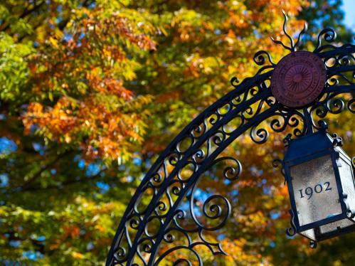 Fall foliage surrounding the gate on Old Queens